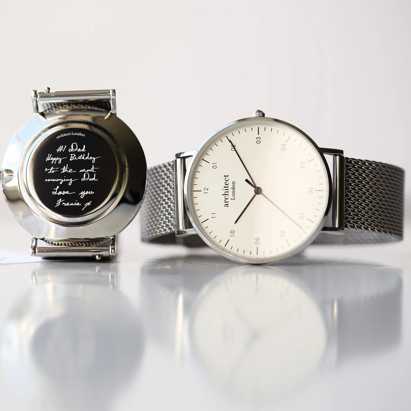 Image of a men's Architect Zephyr watch with a white face and a stainless streel mesh strap. The back of the watch can be engraved with your own handwritten message or drawing.