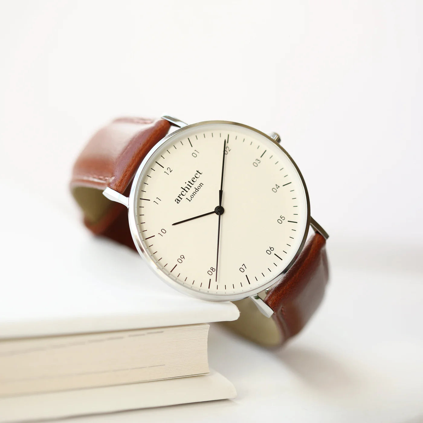 Image of a men's Architect Zephyr watch with an off white face and a walnut leather strap. The rear of the watch can be engraved with your own handwritten message or drawing.