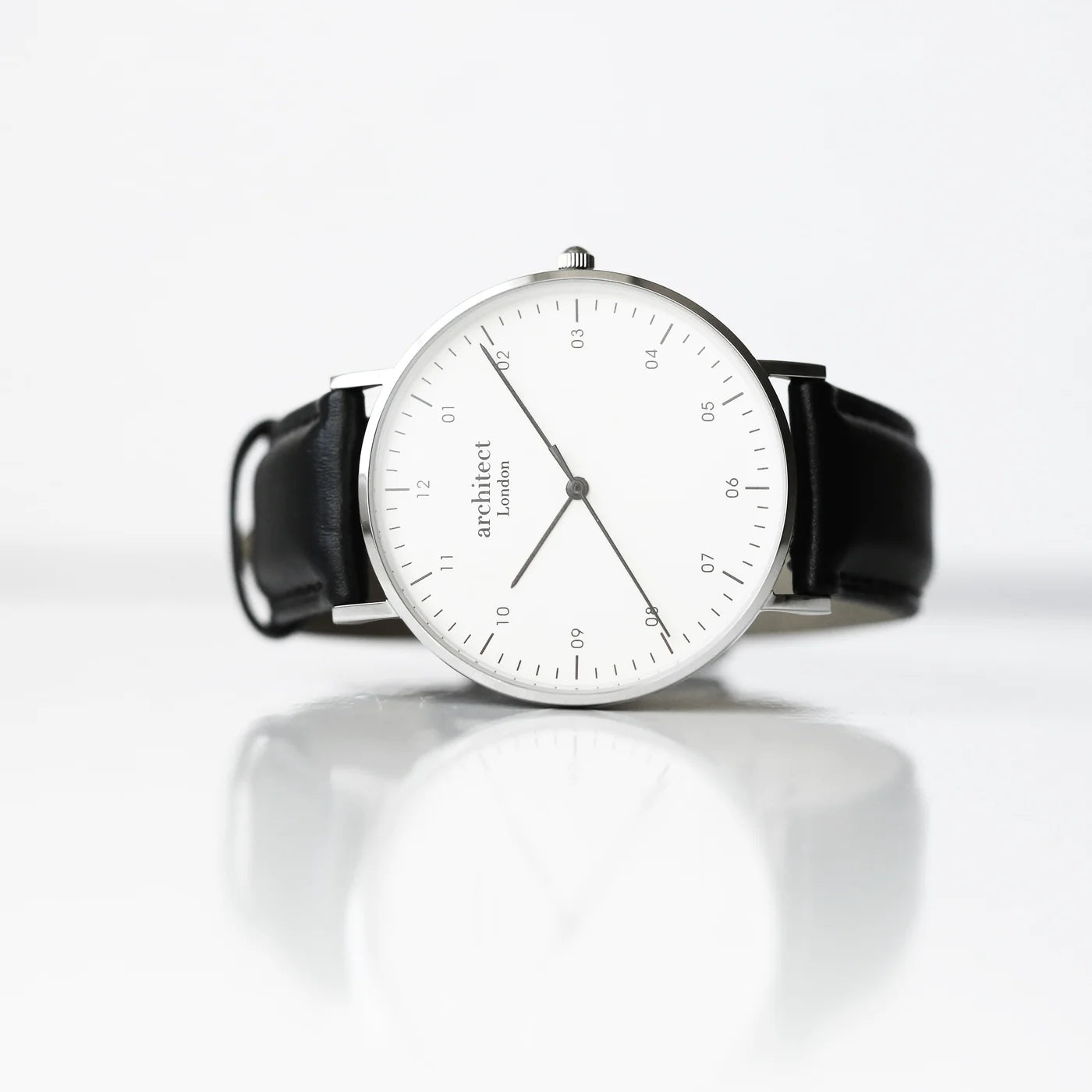 Image of a men's Architect Zephyr watch with a white face and black leather strap. The back of the watch can be engraved with your own handwritten message or drawing.