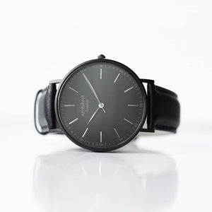 Image of a men's black Architect watch with a black face and leather strap. The back of the watch can be engraved with your own handwritten message or drawing.