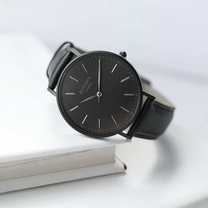 Image of a men's black Architect watch with a black face and leather strap. The back of the watch can be engraved with your own handwritten message or drawing.