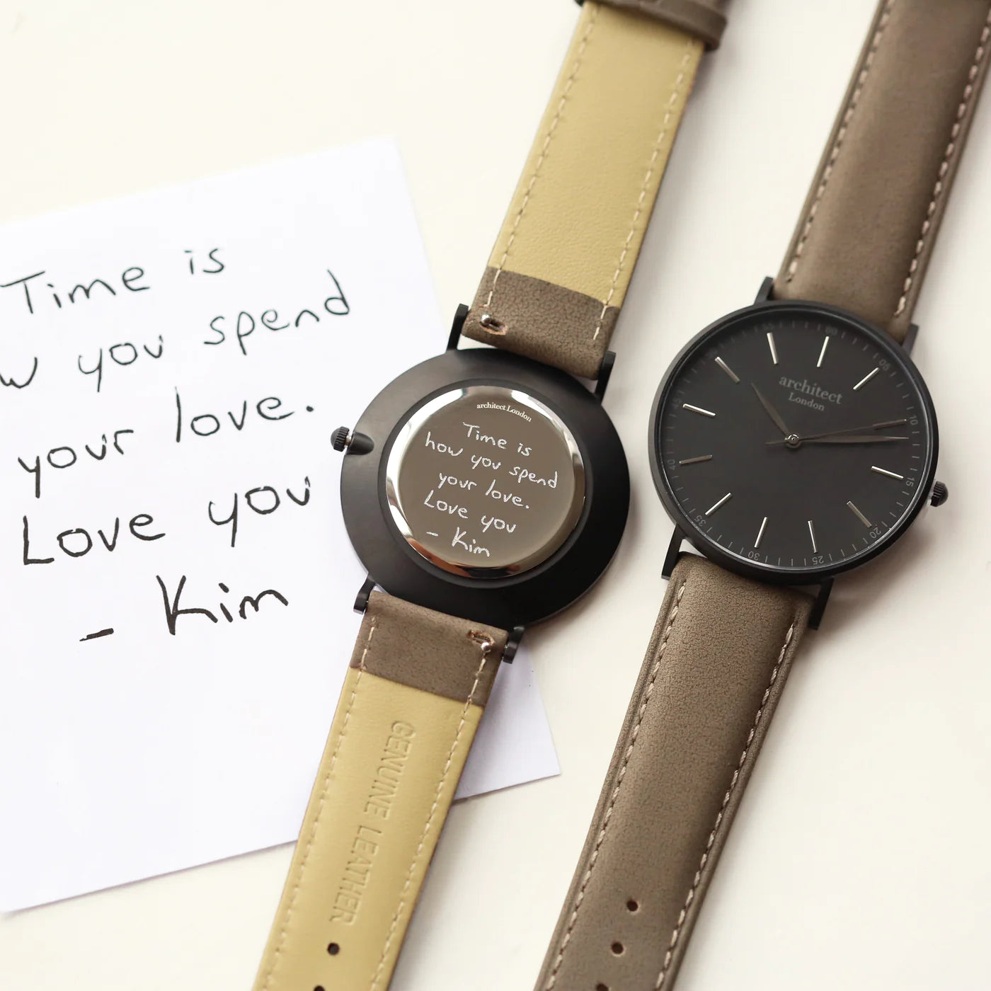 Image of a men's Architect watch with a black face and urban grey leather strap. The back of the watch can be engraved with your own handwritten name or message.