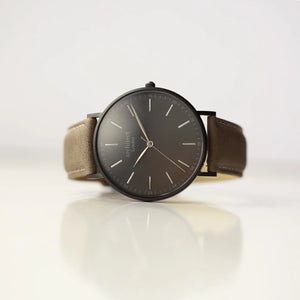 Image of a men's Architect watch with a black face and urban grey leather strap. The back of the watch can be engraved with your own handwritten name or message.