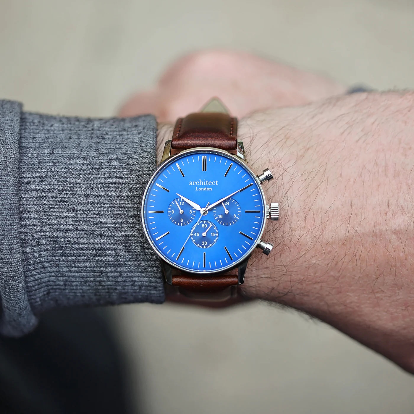 Image of a men's Architect Motivator watch that can be engraved with your own handwritten message on the back. The watch has a face and a brown leather strap.