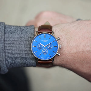 Image of a men's Architect Motivator watch that can be engraved with your own handwritten message on the back. The watch has a face and a brown leather strap.