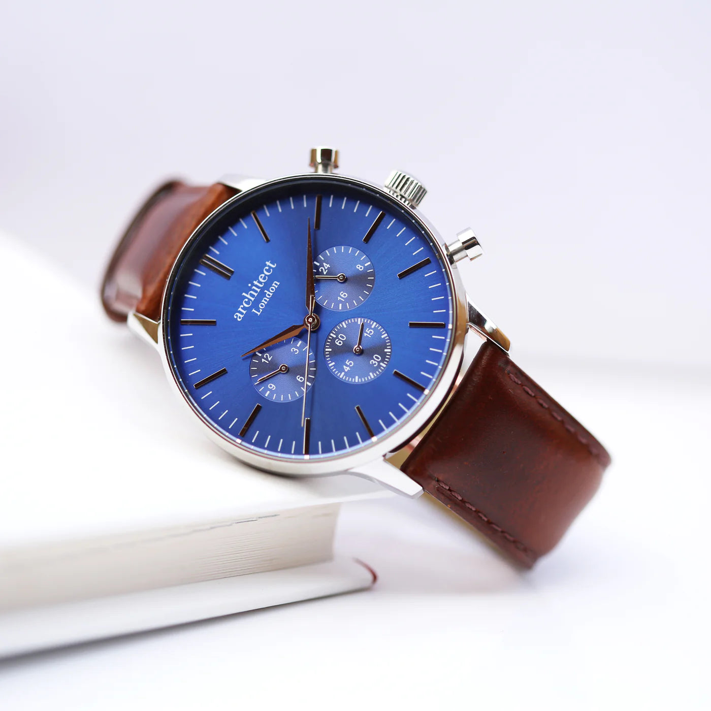Image of a men's Architect Motivator watch that can be engraved with your own handwritten message on the back. The watch has a face and a brown leather strap.