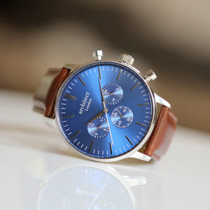 Image of a men's Architect Motivator watch that can be engraved with your own handwritten message on the back. The watch has a face and a brown leather strap.