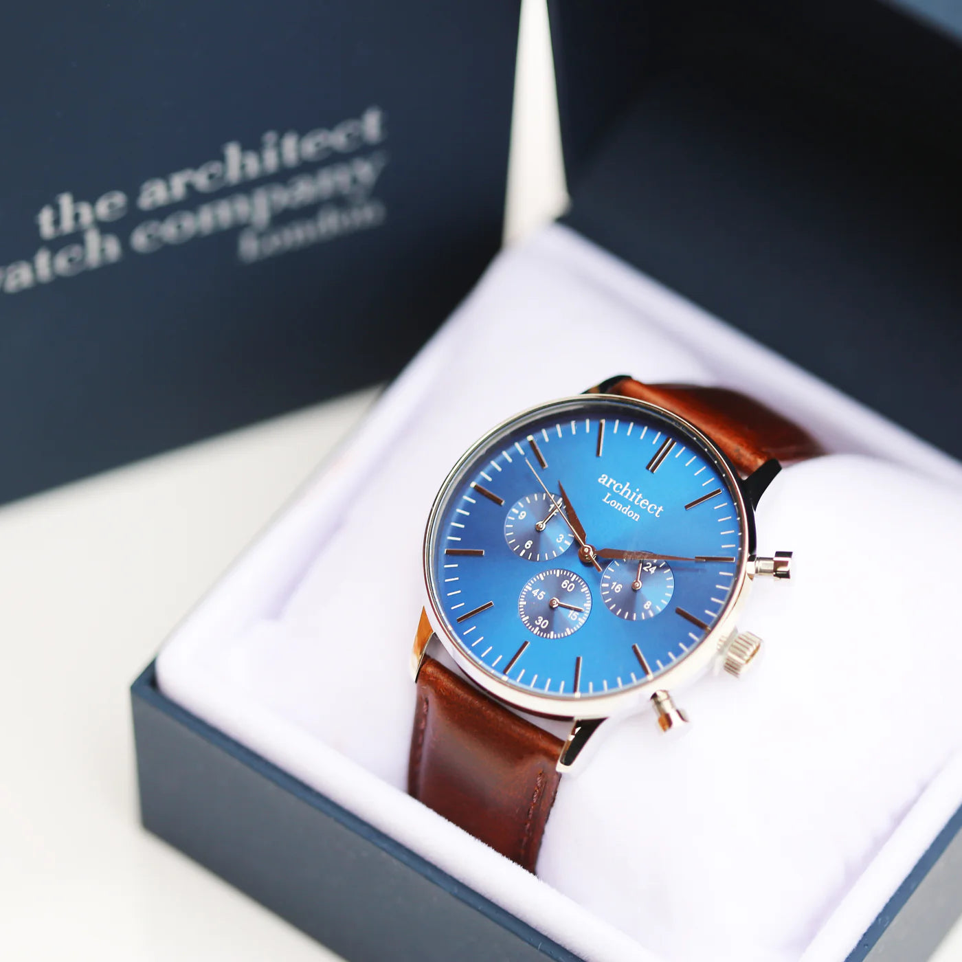 Image of a men's Architect Motivator watch that can be engraved with your own handwritten message on the back. The watch has a face and a brown leather strap.