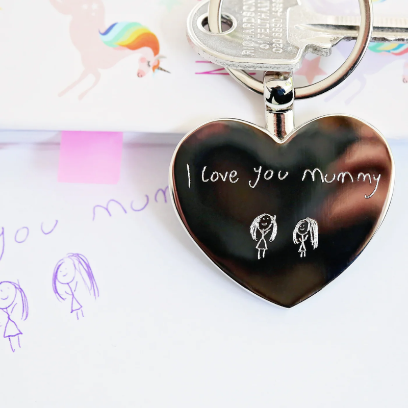 image of a keyring which has been engraved with a childs own drawing. This is part of our collection of gifts which can be printed or engraved with your own handwriting or drawings and artwork.