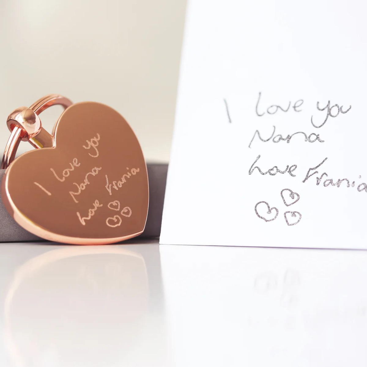 Image of a heart pendant keyring that can be engraved with your own handwriting and/or drawing. A keyring is attached to the pendant which enables you to attach it to keys or a bag.