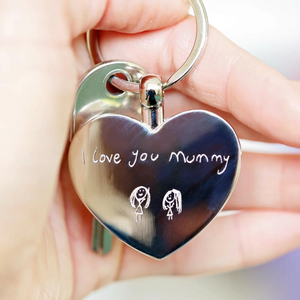 Image of a heart pendant keyring that can be engraved with your own handwriting and/or drawing. A keyring is attached to the pendant which enables you to attach it to keys or a bag.