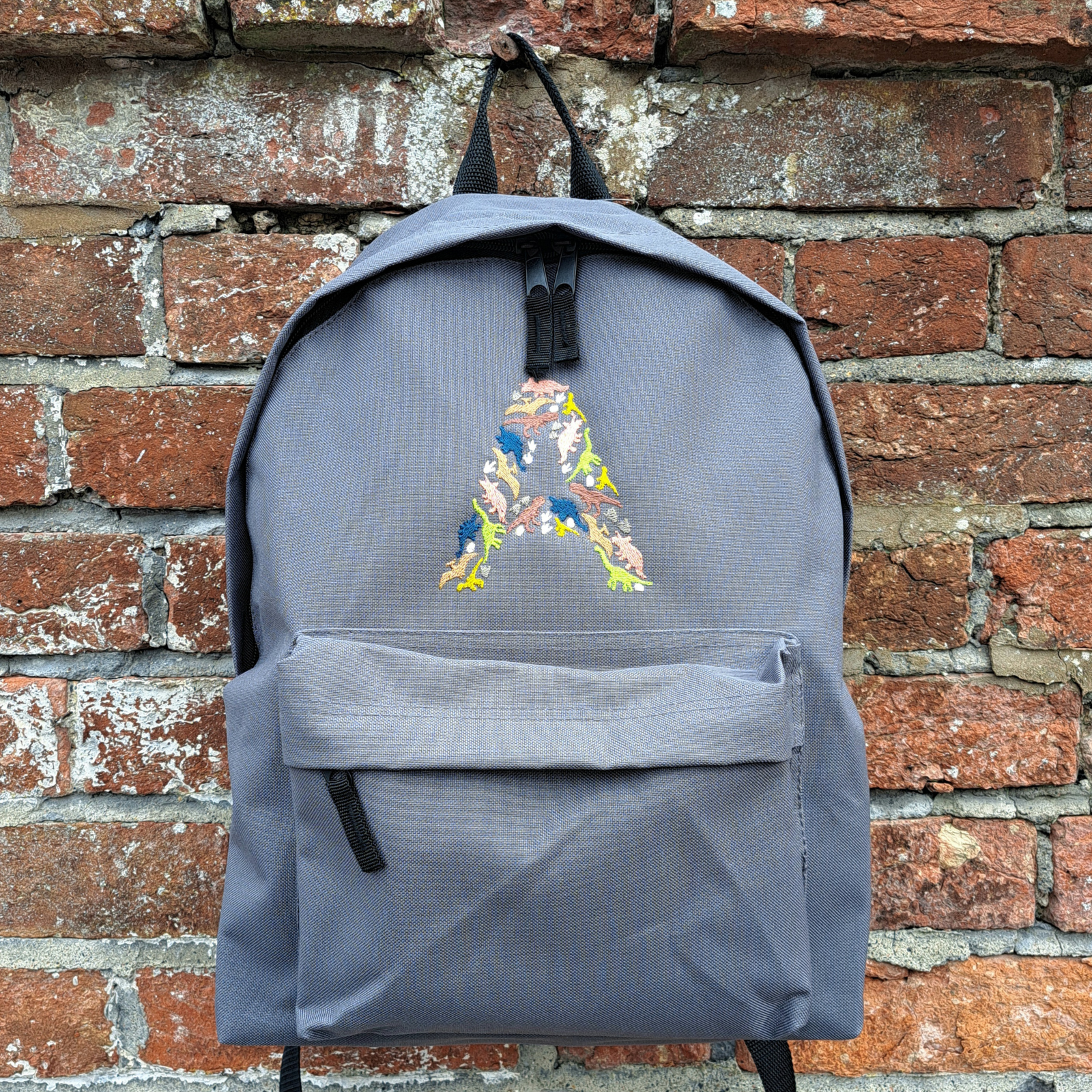 Rucksack available in 12 colours with Dinosaur Initial