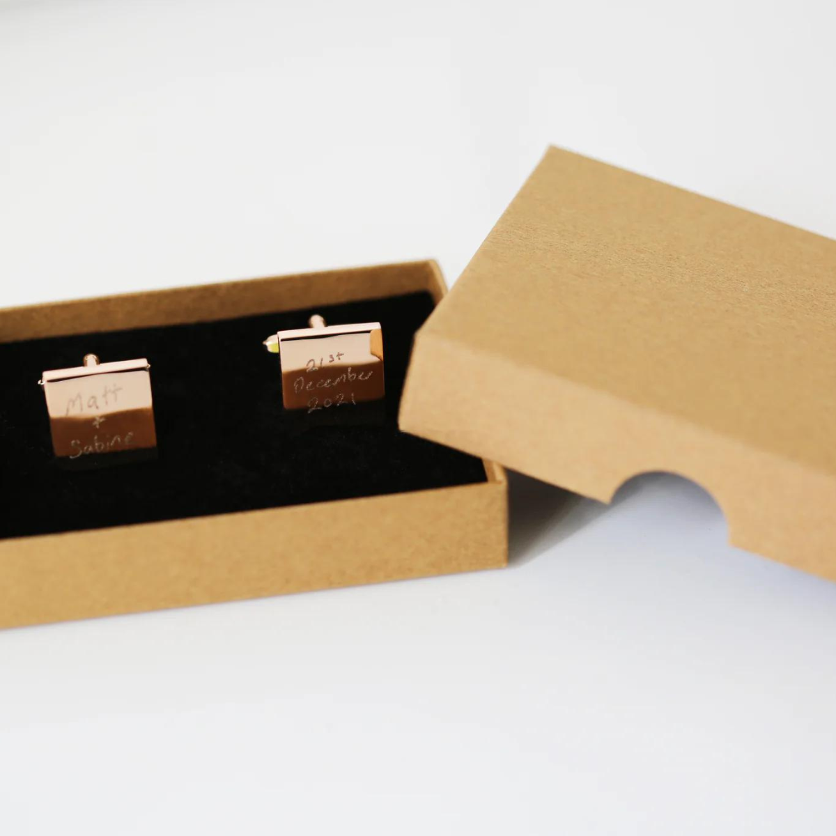 Image of a pair of cufflinks that can each be engraved with your own handwritten message. The cufflinks are available with either a silver or rose gold coloured finish, with a standard eco gift box.
