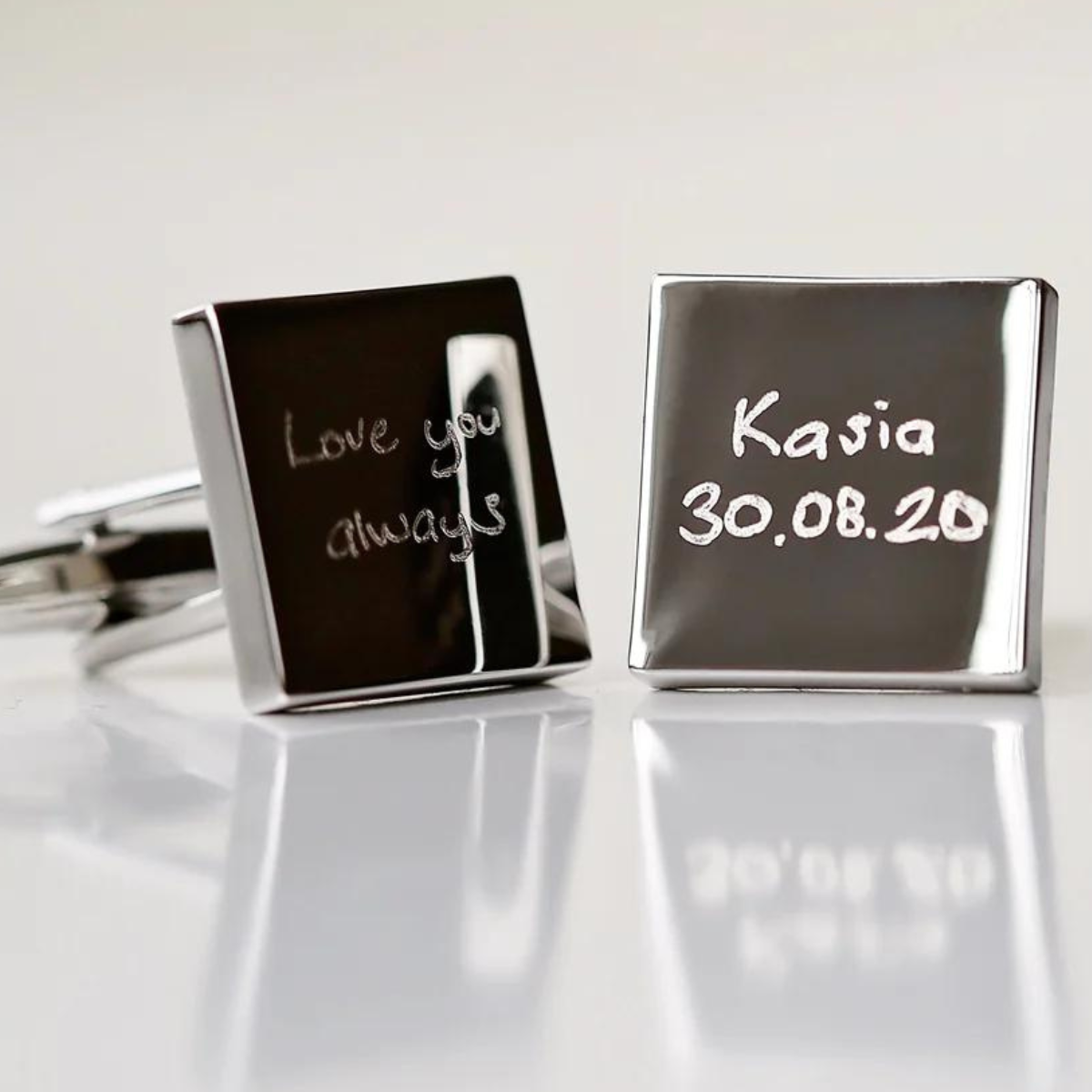 Image of a pair of cufflinks that can each be engraved with your own handwritten message. The cufflinks are available with either a silver or rose gold coloured finish.