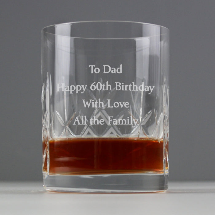 Image of a crystal whisky tumbler with a solid weighty base. The glass can be engraved with a message of your choice over 4 lines of up to 20 characters per line.  The glass measures approximately 9.5 cm high by 8 cm wide