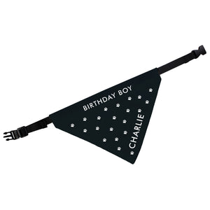 Image of a personalised black dog bandana with small white paw prints