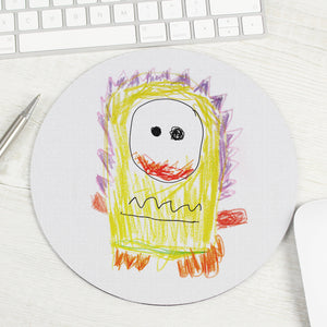 Image of a round mouse mat that can be personalised with your childs own art work. You can choose to have the artwork fill the entire mouse mat or you can add your own text which will be printed underneath the artwork.