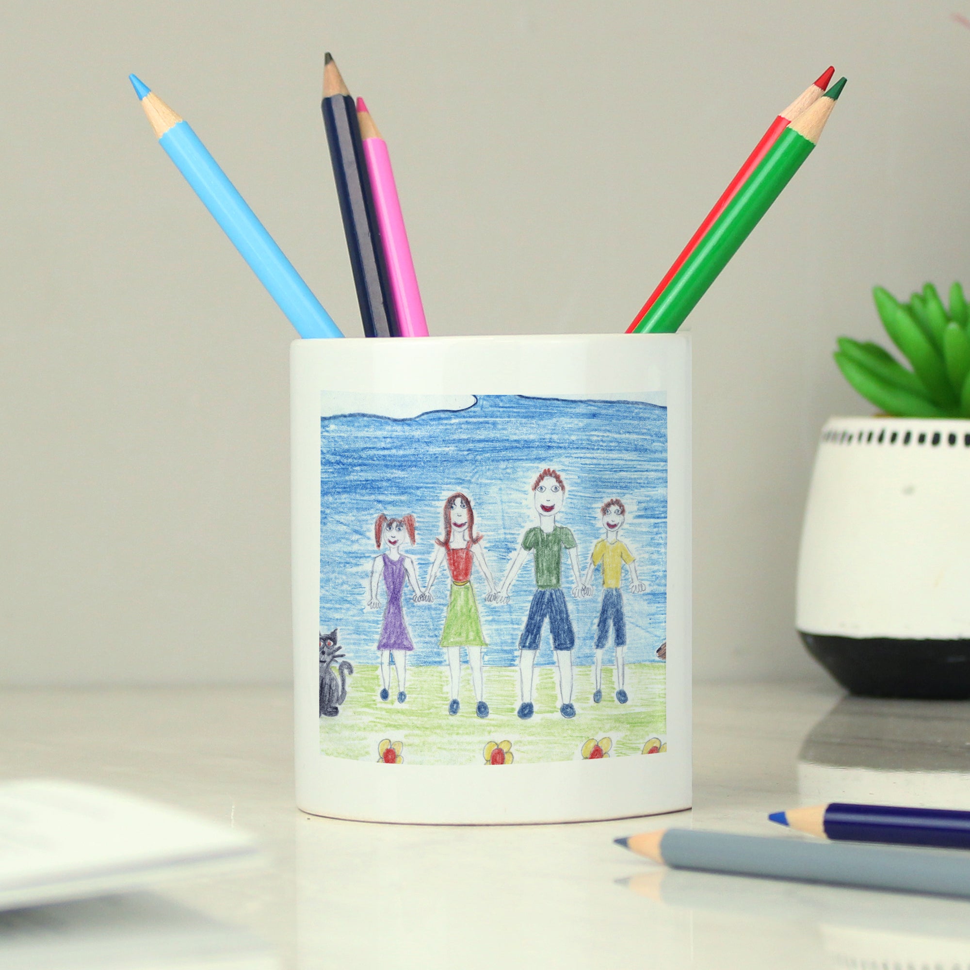 Image of a white ceramic storage pot that can be personalised with your child's own artwork and two lines of optional text.