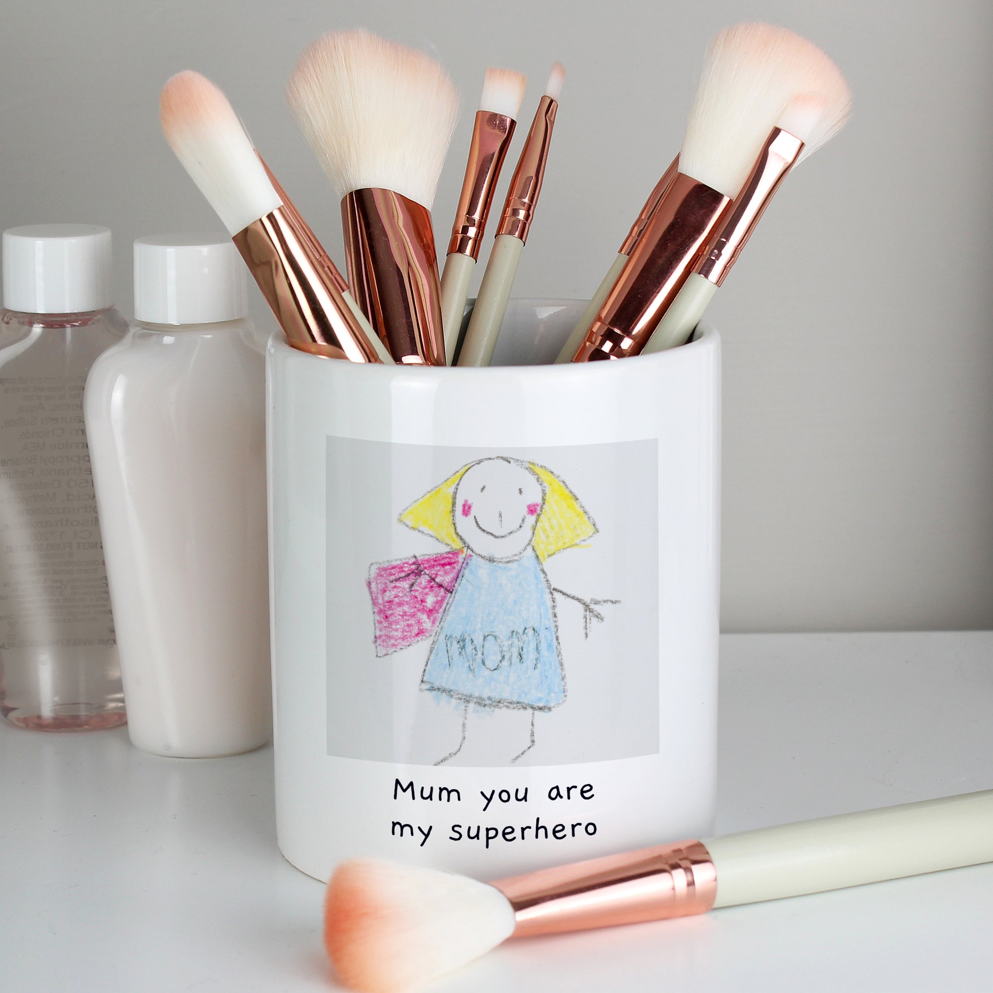 Image of a white ceramic storage pot that can be personalised with your child's own artwork and two lines of optional text.