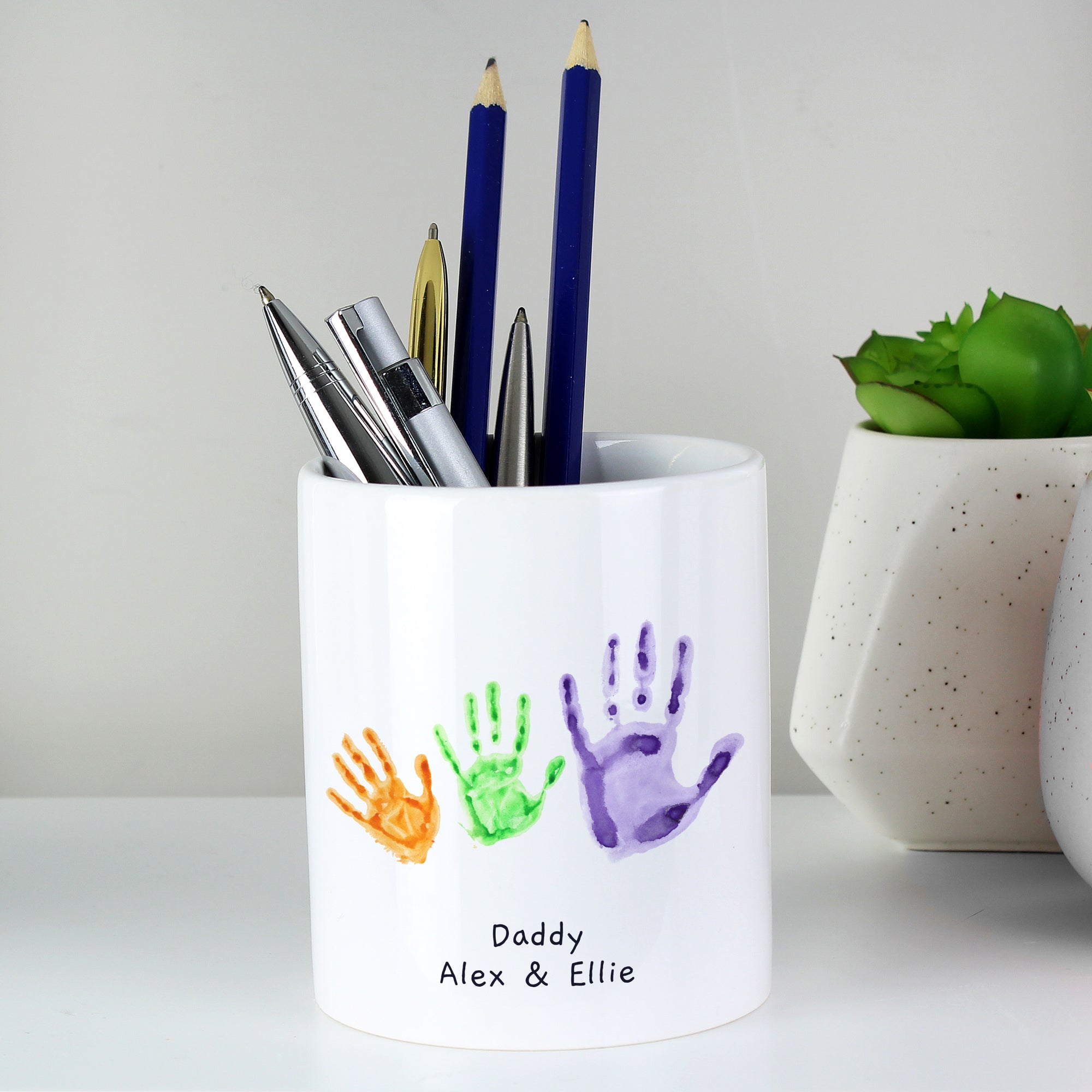 Image of a white ceramic storage pot that can be personalised with your child's own artwork and two lines of optional text.