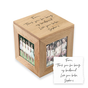 Image of an oak photo cube and keepsake box. You can put a photo into each of the four sides of the cube and the lid of the cube can be engraved with your own handwritten message. The inside of the box can be used to store small mementos.