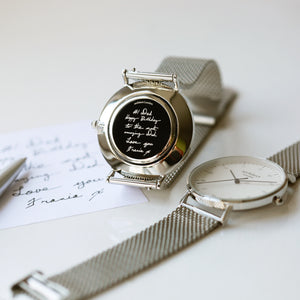 Front and rear image of a men's watch that can be engraved on the back with your own handwriting. The watch is made by Architect London and has a large white face and a stainless steel mesh strap. The rear of the watch can be engraved with your message written in your own handwriting.