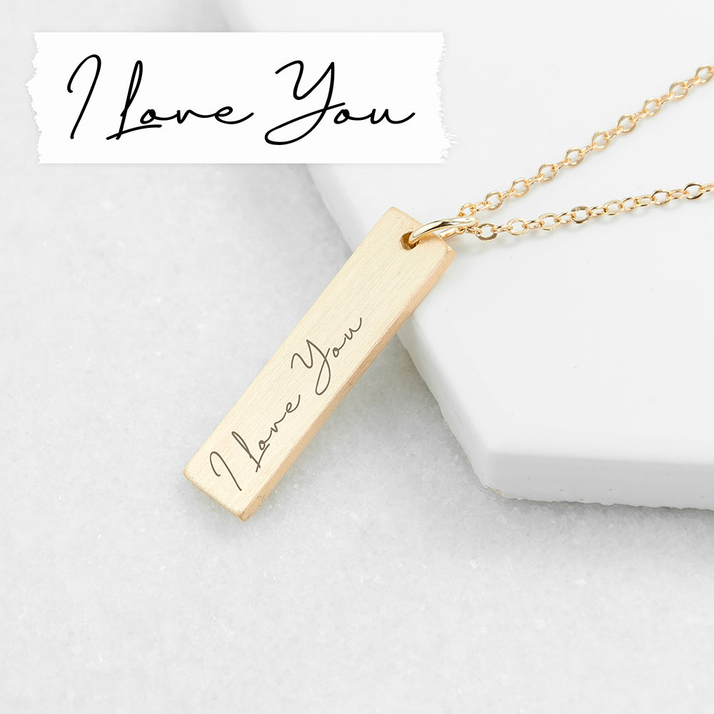 A gold plated necklace with a bar pendant that can be engraved with your own handwritten note or the writing of a loved one.