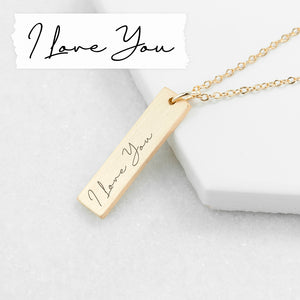A gold plated necklace with a bar pendant that can be engraved with your own handwritten note or the writing of a loved one.
