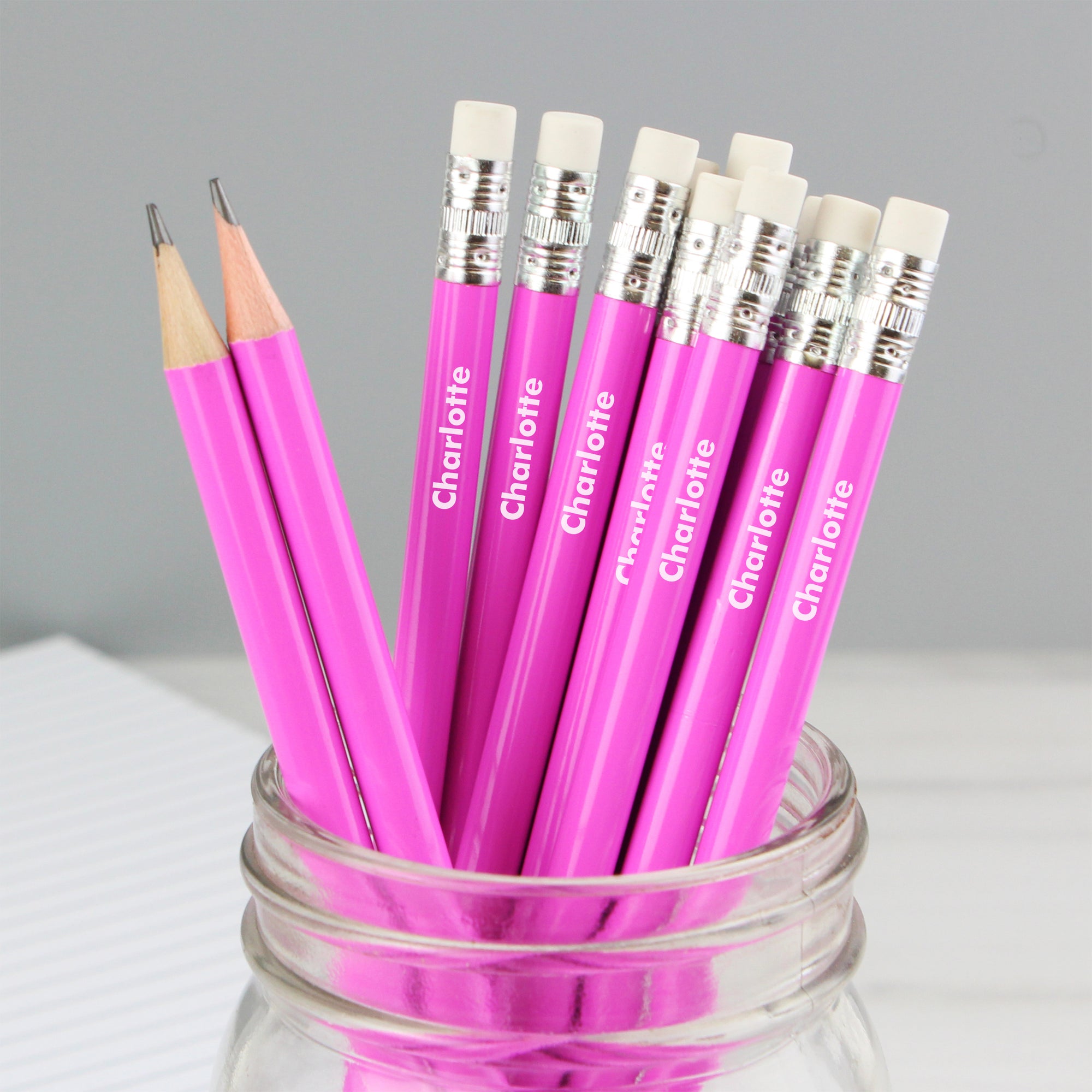 Set of 12 personalised HB pink pencils topped with an eraser.