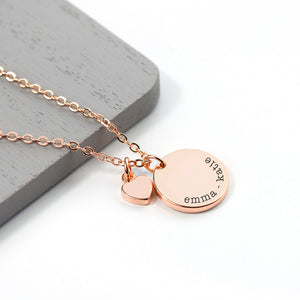 Personalised rose gold plated necklace with a disc that can be engraved with a name or message of your choice and a small heart charm next to it. The necklace comes with a rose gold plated necklace.