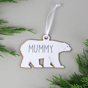 Personalised adult polar bear decoration as part of a family set of two adults and two baby bears. Each bear is painted white and can be personalised with a name of up to 12 characters which will be printed on each bear in a modern grey uppercase font.