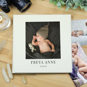 Image of a white square photo album which can be personalised on the front cover with your own photo as well as your own text over 2 lines. Internally the album holds up to 120 6" by 4" photos with space by each one for your own handwritten comments.
