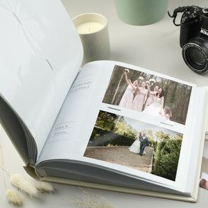 Image of the internal pages of our personalised white square photo album. Each page can hold 2 x 6" by 4" photos on each side and there is space by each photo for your own handwritten comments.