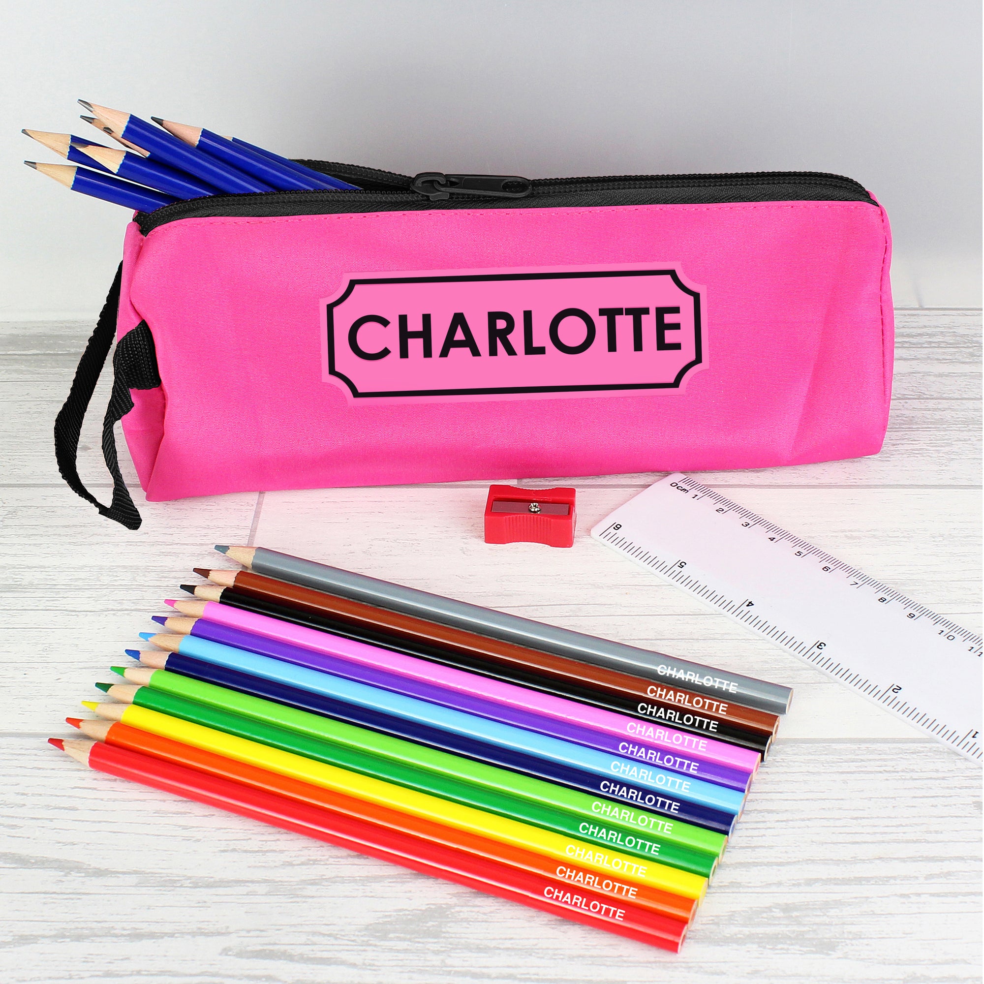 Personalised pink pencil case with personalised colouring and HB pencils plus a ruler and pencil sharpener