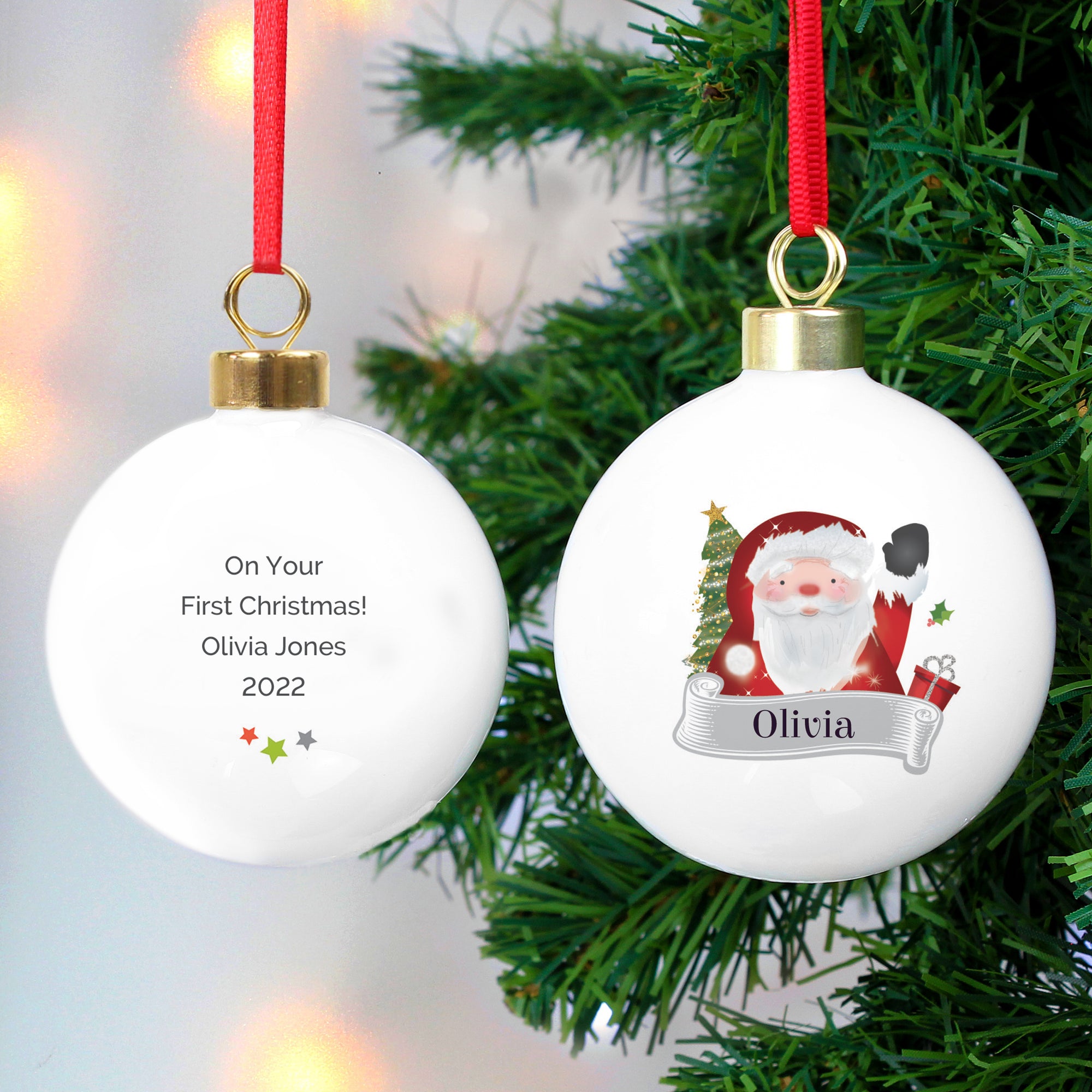 Image of the front and back of a personalised Christmas bauble. The bauble is white, the front features an image of a happy Santa waving and below him is a grey banner which will have a name of your choice printed in it in black font. You can add your own message to the back of the bauble which will be printed in a black font with three stars underneath the writing.