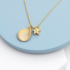 Personalised necklace plated in 18ct gold. The necklace has a matt finish drop shape on them and a small matt finish star which can be engraved with an initial.
