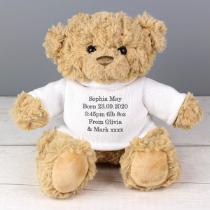Image of a personalised traditional teddy bear with soft light brown fur sitting down. The teddy is wearing a white jumper that can be personalised with your own message over up to 5 lines in your choice of grey, pink or blue.