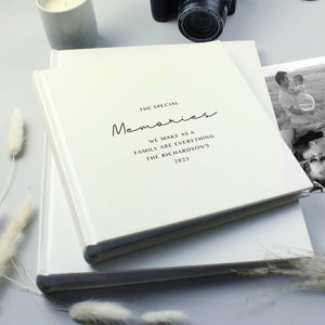 Image of a white square photo album where the front cover can be personalised with your own text over up to 6 lines. Internally the album can hold up to 120 6" by 4" photos with space beside each one for your own handwritten notes.