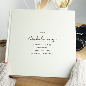 Image of a white square photo album where the front cover can be personalised with your own text over up to 6 lines. Internally the album can hold up to 120 6" by 4" photos with space beside each one for your own handwritten notes.